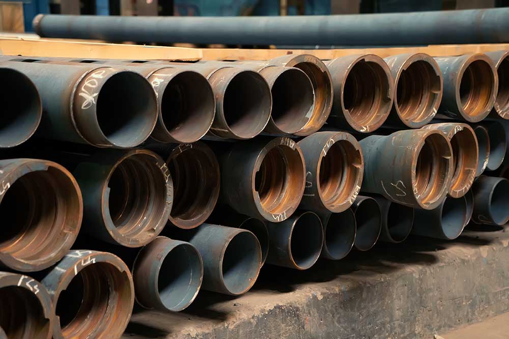 Garon T Plumbing, Heating, and Air Conditioning technician inspecting a cast iron pipe